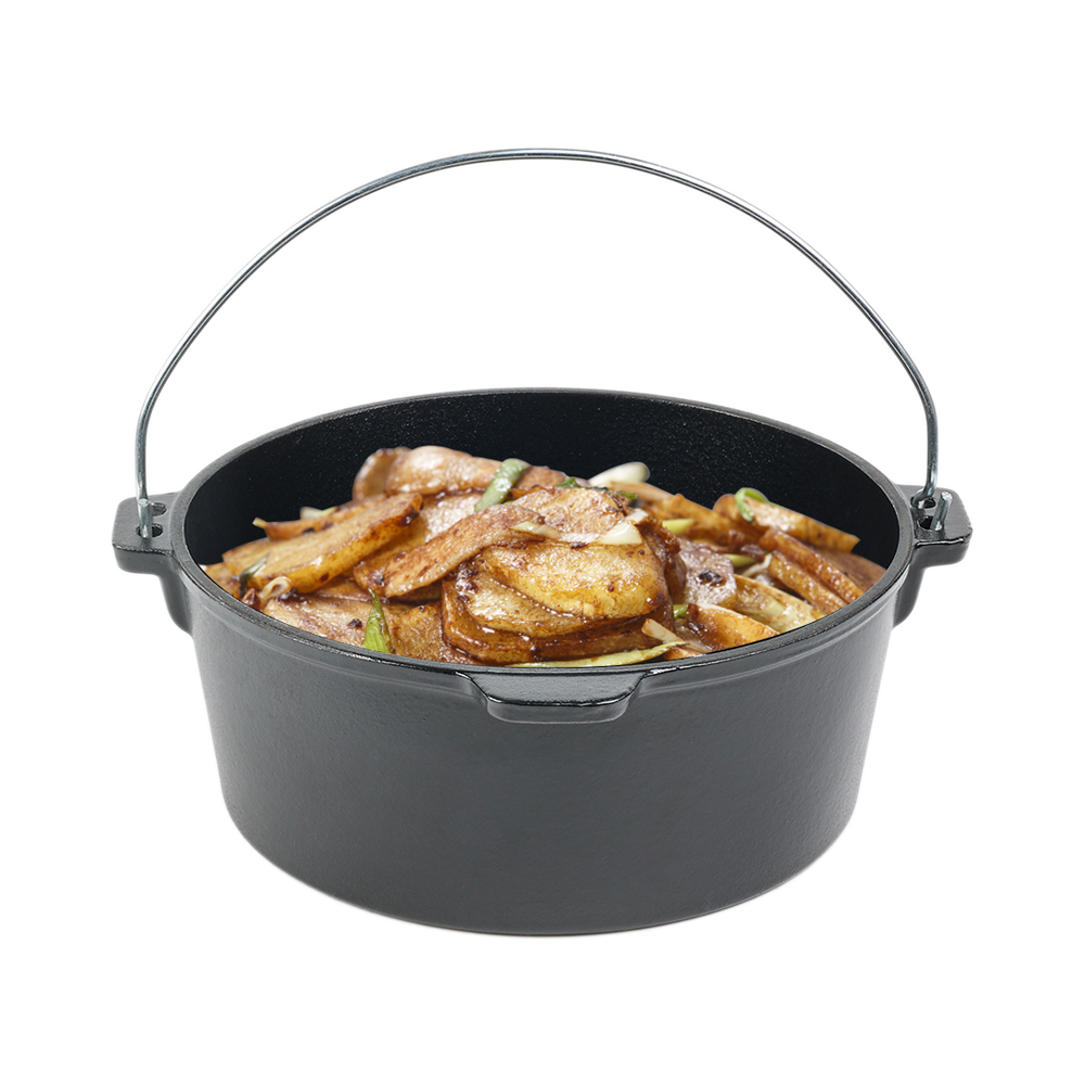 Savory stir-fried potato and pork slices simmering in a heavy-duty cast iron Dutch oven pot, showing campfire cooking versatility.