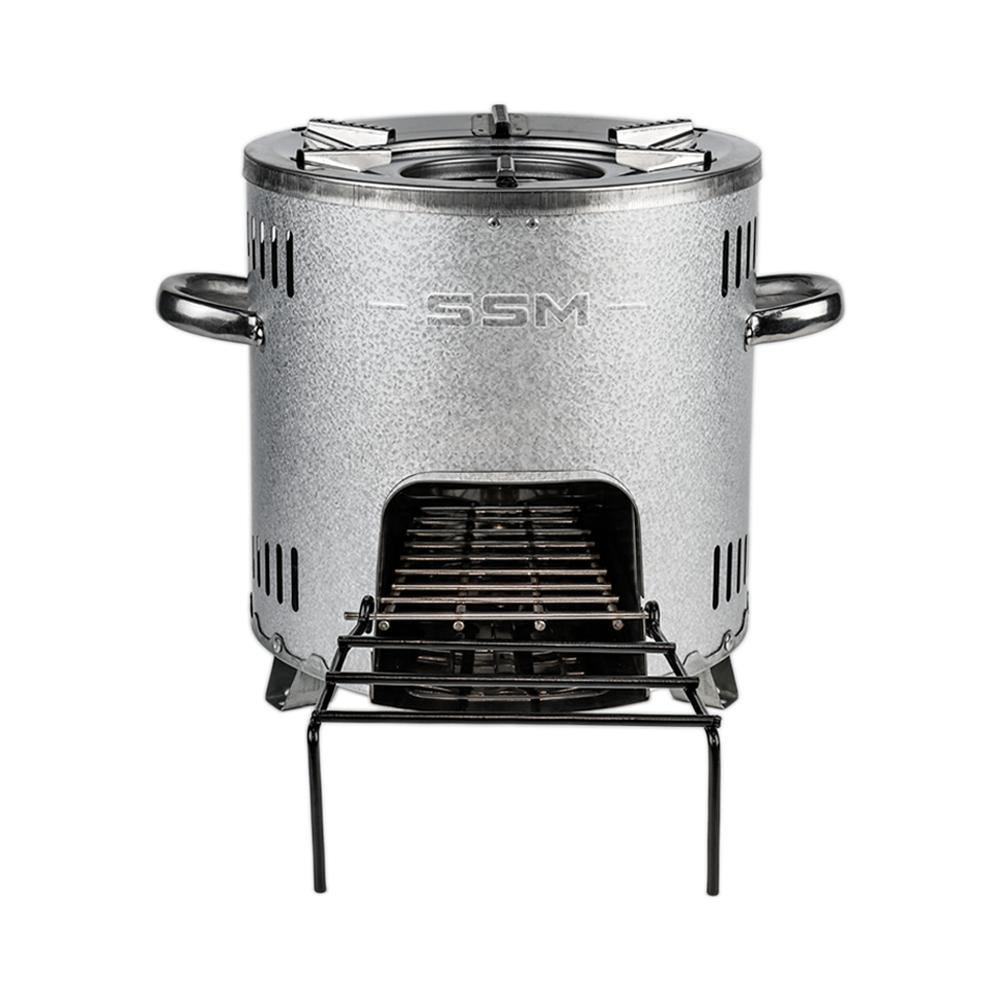 A front-facing view of the S26-11E firewood stove, showing the aluminized zinc plated finish, SSM branding, and the fuel loading door with an extended stick support rack.