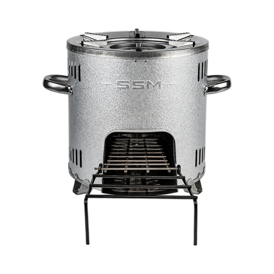 A front-facing view of the S26-11E firewood stove, showing the aluminized zinc plated finish, SSM branding, and the fuel loading door with an extended stick support rack.