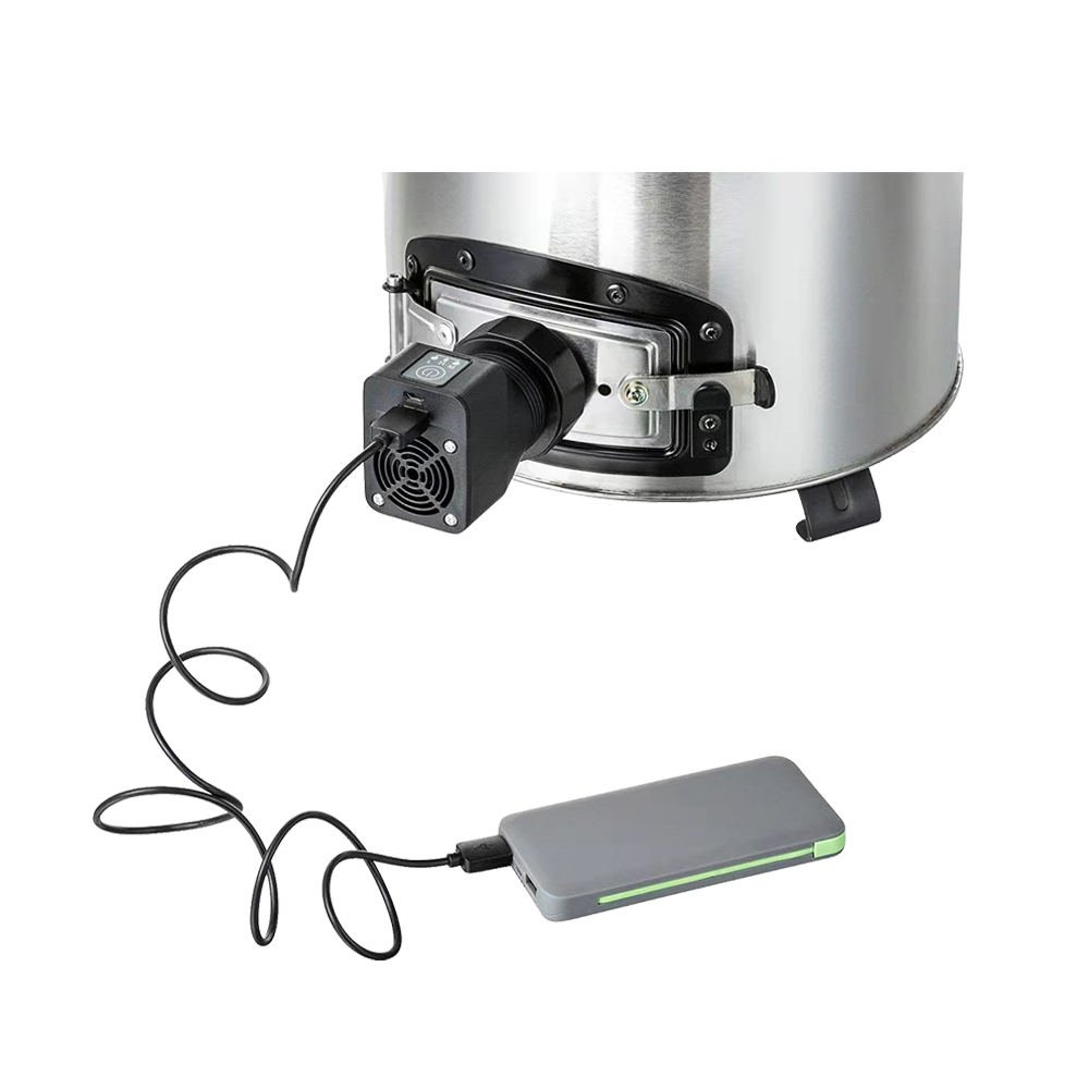 Close-up of the F-18 fan stove’s airflow module connected to a portable power bank for mobile operation.
