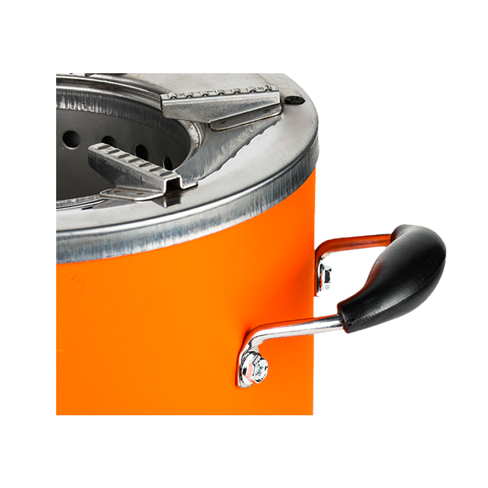Close-up view of the sturdy side handle and top rim of the orange C26-12 charcoal stove, showing the built-in pot supports and clean cook design.
